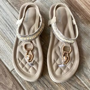 Tan and gold sandals